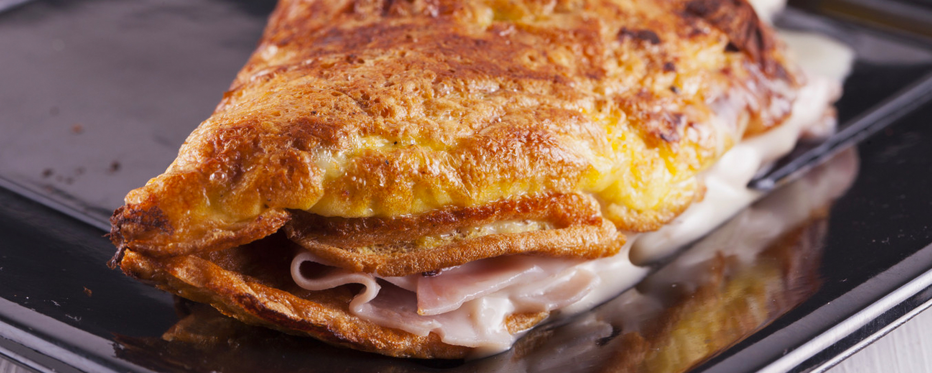 Photo of - Whole Wheat Crêpes with Prosciutto and Friulano Cheese